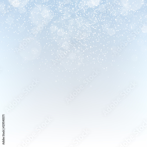 Winter abstract background with falling snowflakes and sparkles.