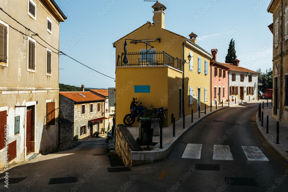 One road goes up, the other down. Crossroads in an old European city Vrsar, Croatia.
