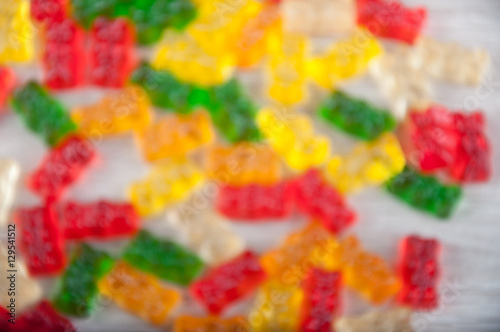 Blurred pattern of heap of multicolored gummy bear sweets