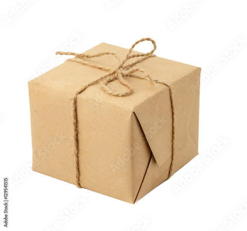 Gift box or mail parcel, wrapped with craft paper and twine isolated
