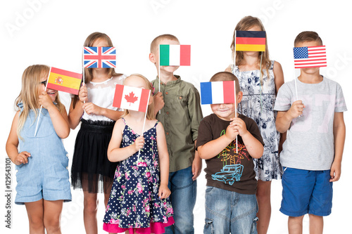 Obraz na płótnie poland group holding flags of different countries. German flag, flag england, spain flag, flag of america, flag of russia, france flag, flag canada w salonie