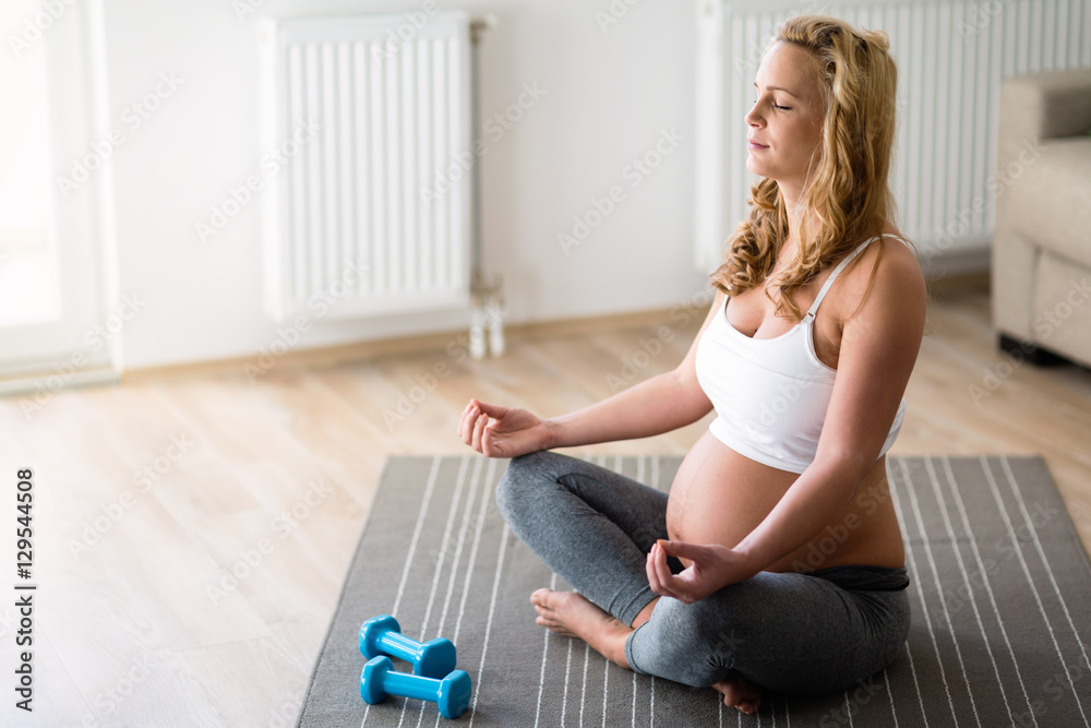 Pregnant woman in lotus posture