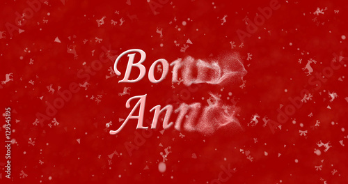 Happy New Year text in French "Bonne ann?e" turns to dust from bottom on red background