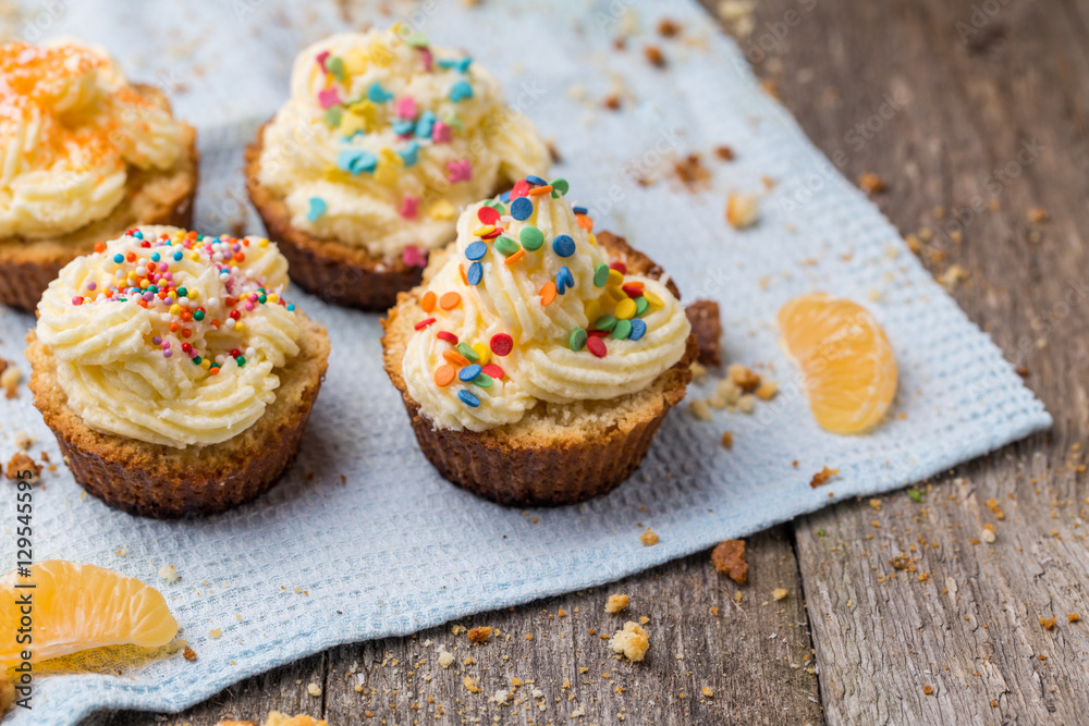 Cupcakes with white frosting and sprinkles Cupcakes with white frosting and sprinkles
