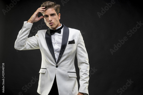 Canvas Print Elegant and handsome man dressed in tuxedo for New Year's Eve or