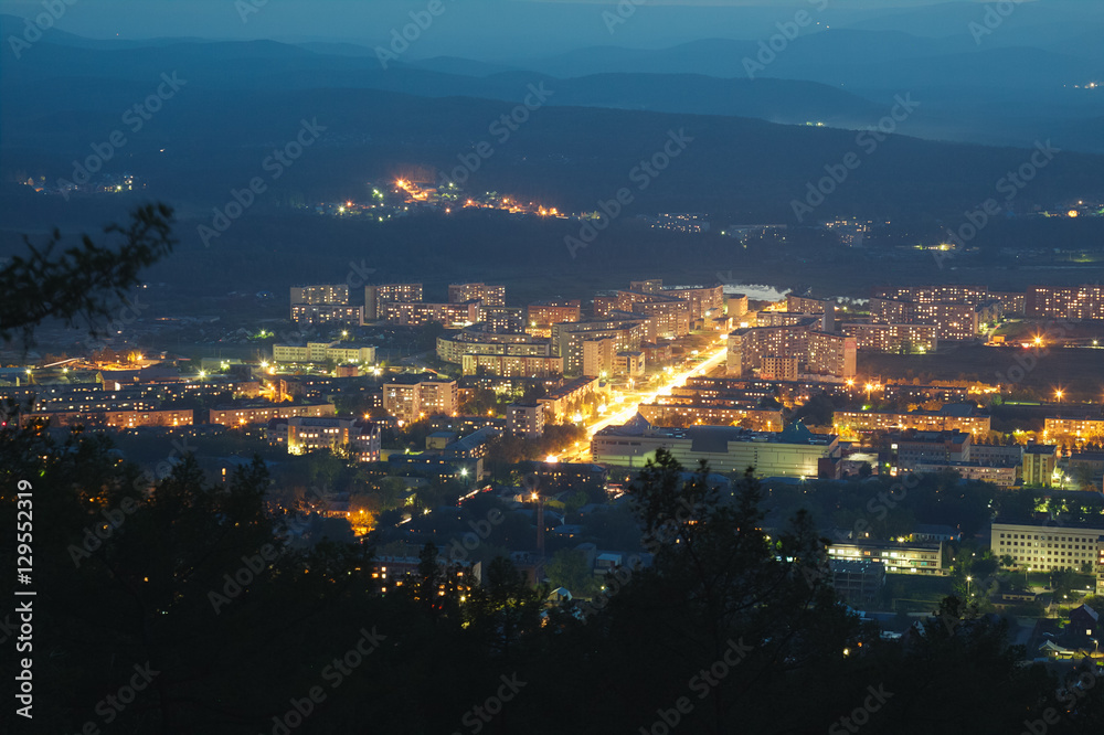 Night view of the city in the mountains.