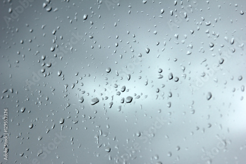 Falling raindrops on glass 