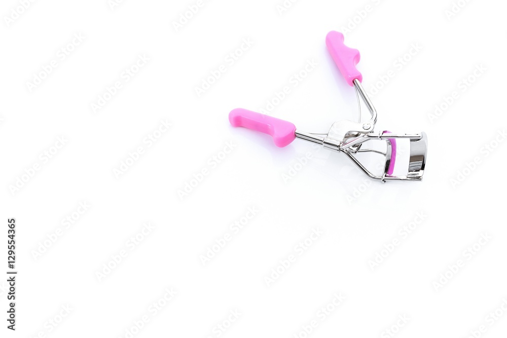 Close-up the Eyelash curler with pink handles isolated on white - Metal eyelash curlers with copy space
Close-up the Eyelash curler with pink handles isolated on white - Metal eyelash curlers with copy space
