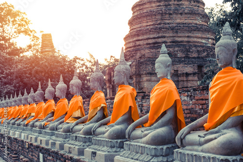 Buddha statue with sunset in ttemple of Wat Yai Chai Mongkol in photo