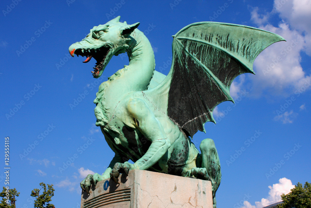 Large green Dragon statue on bridge in Ljubljana, Slovenian symbol