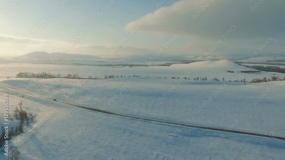 Winter road across the fields. Winter road across the fields.