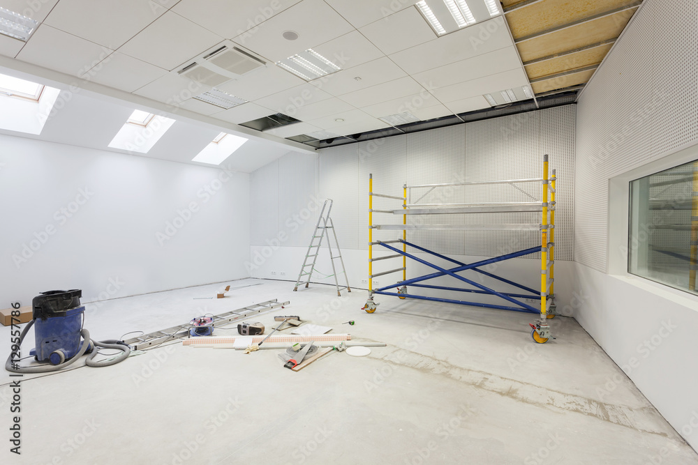 Unfinished building interior, white room.