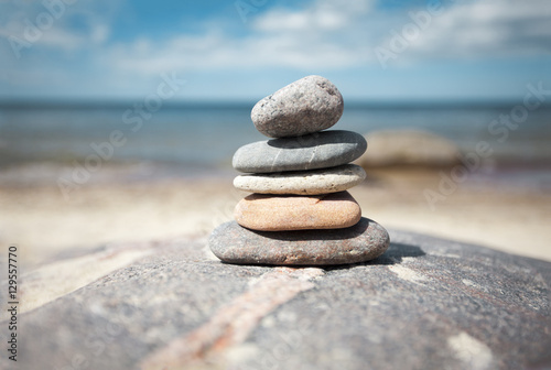 Stack of stones on the seaside in summer