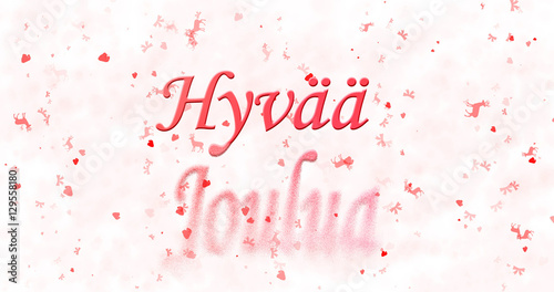 Merry Christmas text in Finnish "Hyvaa joulua" turns to dust from bottom on white background