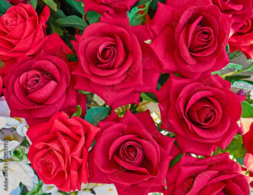 vibrant red fake rose flowers closeup