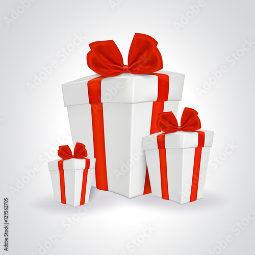 Three white gift boxes with red ribbon.