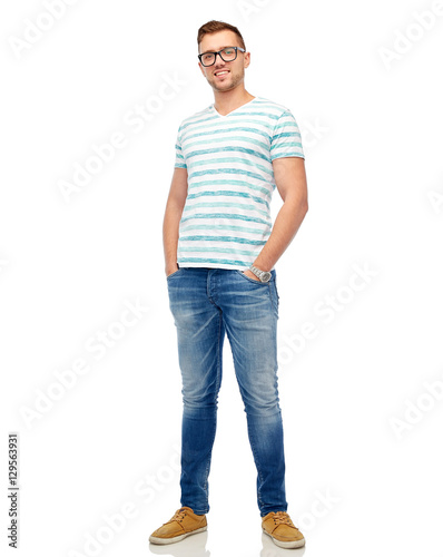 smiling young man in eyeglasses over white