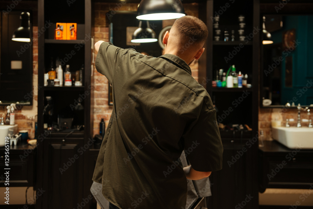 Professional stylist cut hair of his client Professional stylist cut hair of his client