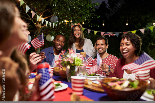 Friends Celebrating 4th Of July Holiday With Backyard Party