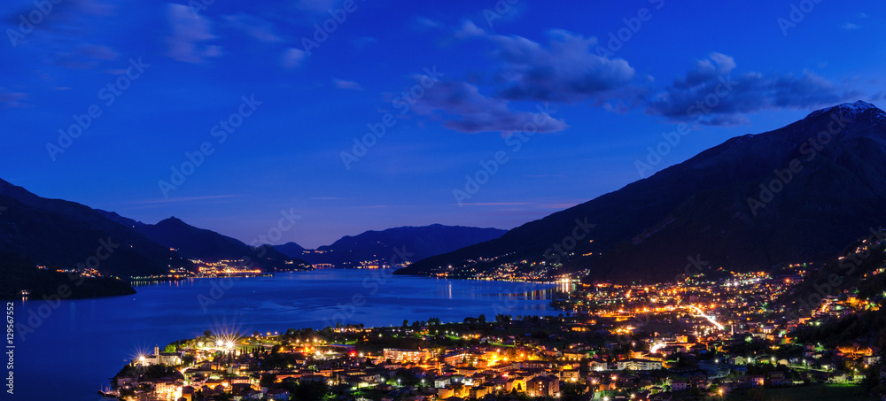 Lago di Como scenic night view with city of Gravedona in the foreground