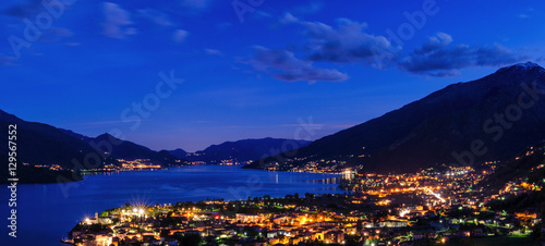 Lago di Como scenic night view with city of Gravedona in the foreground