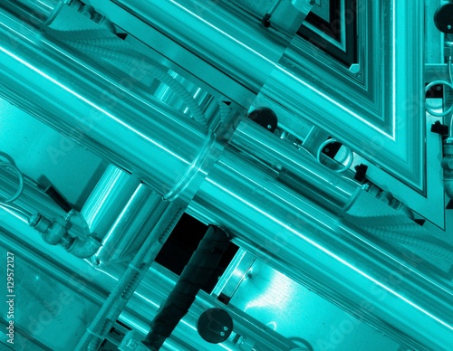 Blue aluminum background. Metal pipes and abstract technological components. industrial concept.