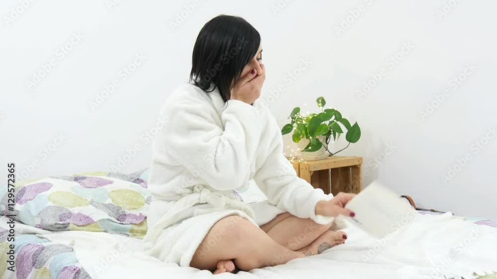 Beautiful young woman read a book and go to sleep Beautiful young woman read a book and go to sleep