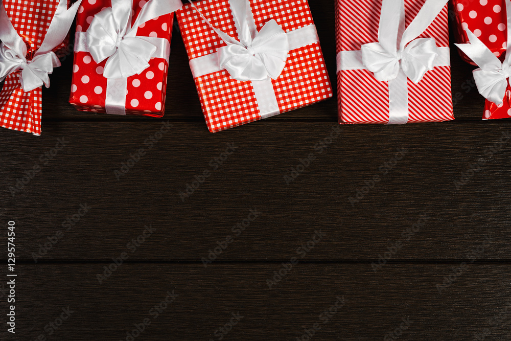 Fototapeta premium Holiday red christmas gift box background, Top view celebrate
