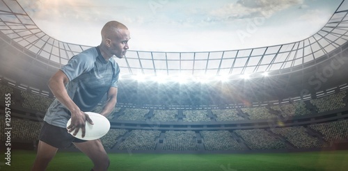 Composite image of sportsman throwing rugby ball 3D