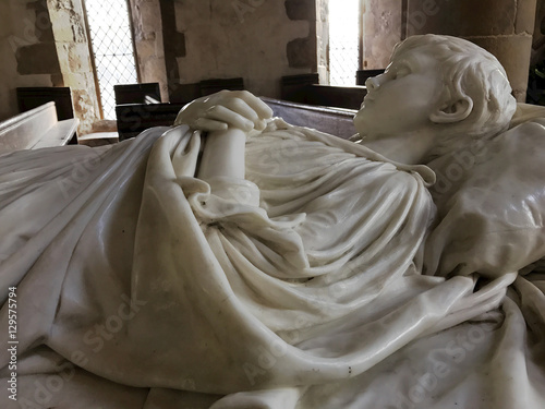 BAKEWELL, ENGLAND - DECEMBER 4: Interior of chapel at Haddon Hall. Tomb of young Lord Haddon in marble. In Bakewell, Derbyshire, England. On 4th December 2016. photo