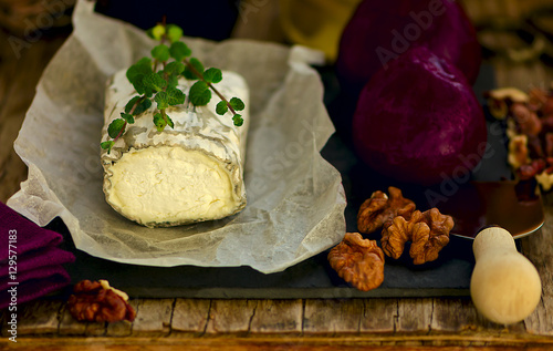 Ukrainian soft-ripened  goat cheese Valoc (aka French Sainte Maure de Touraine or  Buche de Chevre) with beetroot, walnuts and mint