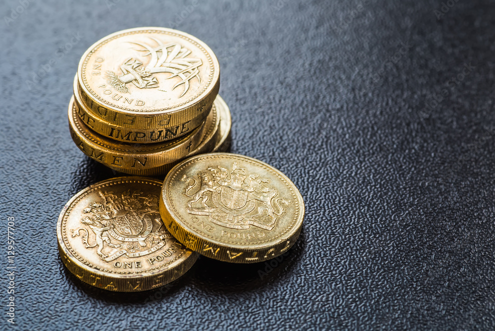British coins stack on black, pound sterling British coins stack on black, pound sterling