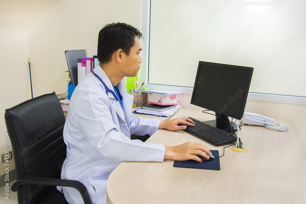 doctor and stethoscope use computor in office doctor and stethoscope use computor in office