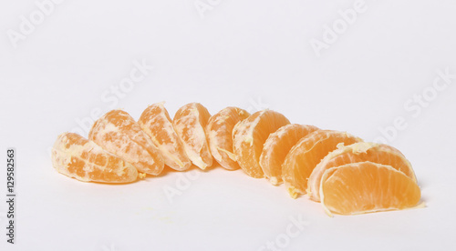 delicious and juicy slices of Mandarin on white background