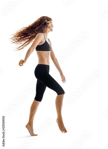 Happy dancing girl with flying hair