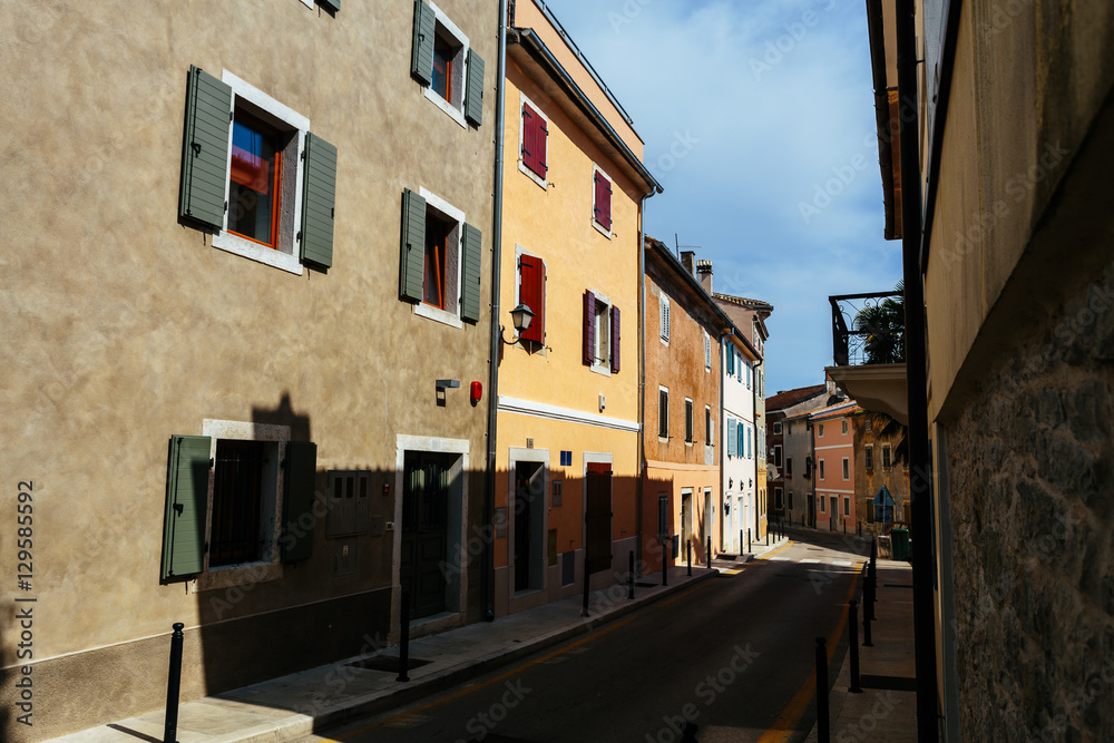 An empty street with colored houses in the center of Vrsar, Croatia.