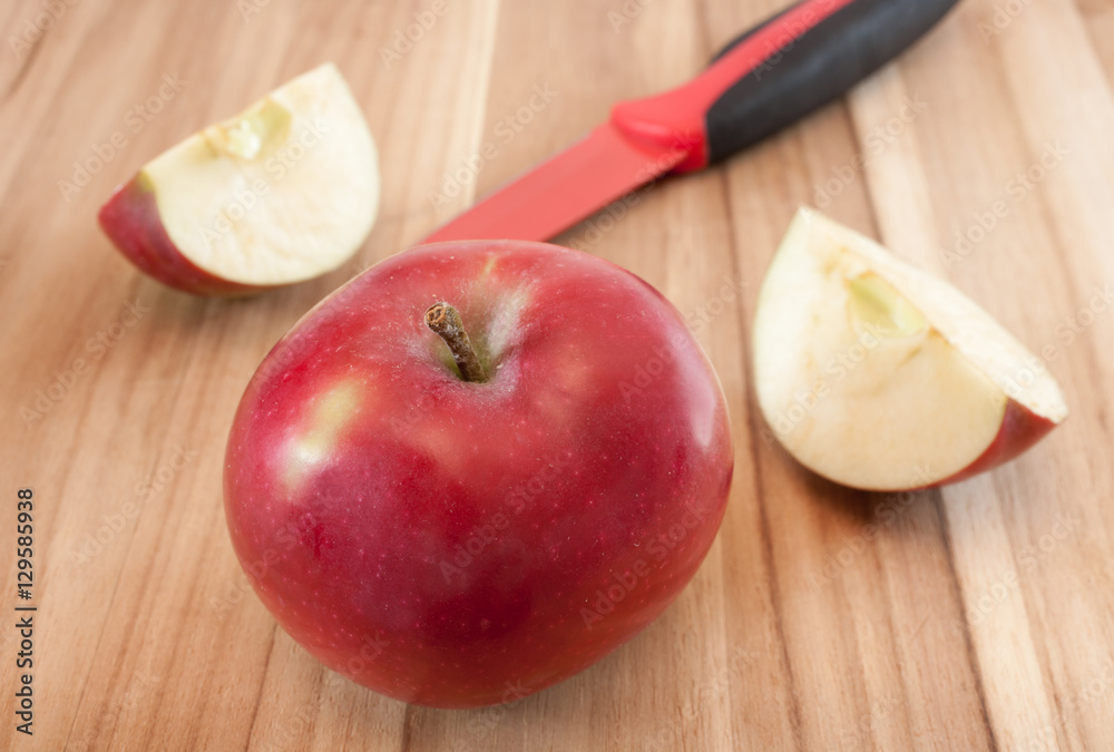 Apples and kitchen knife on wooden surface. Apples and kitchen knife on wooden surface.