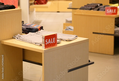 sale sign on clothing shop photo