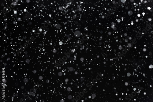 Real snow on black background