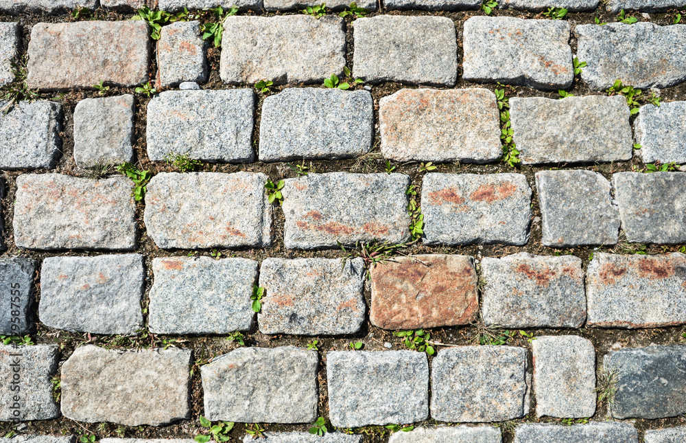 Obraz premium Cobbled stone road background photo