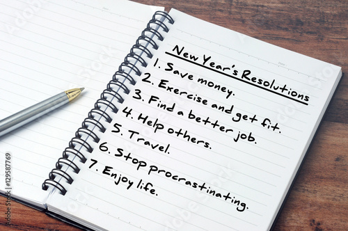Photography List of New Year's resolution on notepad, vintage style.