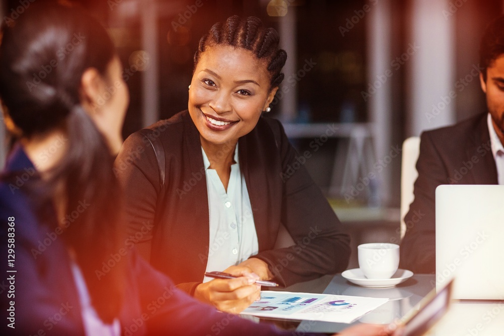 Businesswoman interacting with colleague Businesswoman interacting with colleague