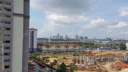 Vászonkép High angle view of cityscape with construction site and high rise over cityscape