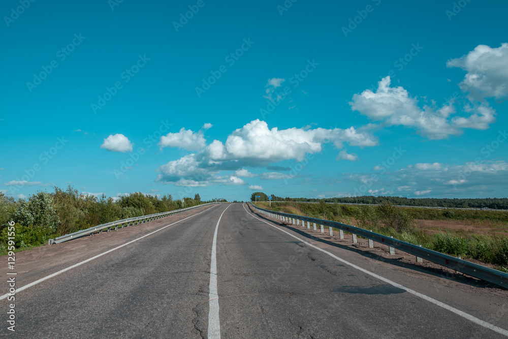 Fototapeta premium View of the empty road as though going to the cloudy sky