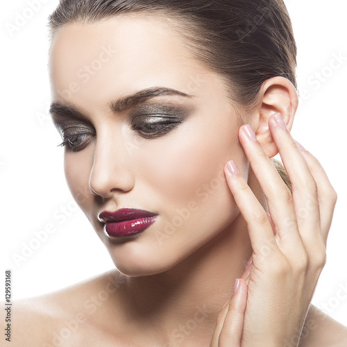 Close-up face of young woman with natural lips with red glossy lipstick isolated on white background