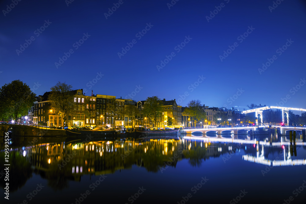 Amsterdam city view with canals and bridges