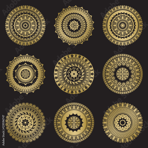 Gold color round abstract ethnic ornament mandalas photo