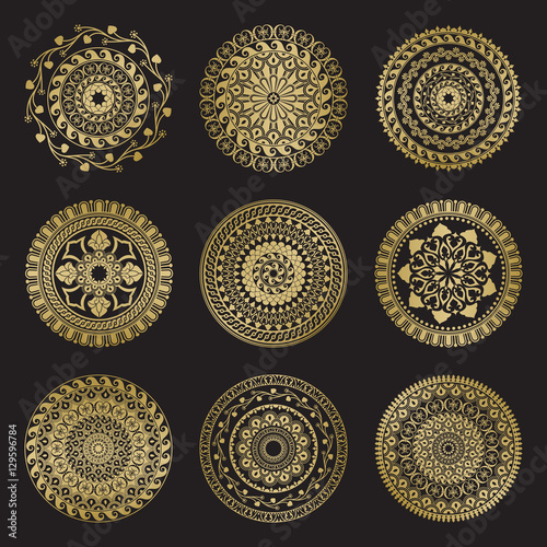 Gold color round abstract ethnic ornament mandalas photo