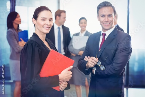 Portrait of businessman standing with lawyer photo