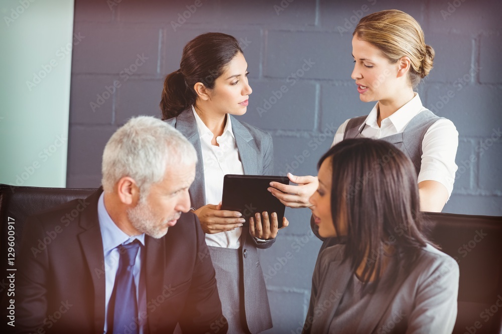 Business people interacting in conference room Business people interacting in conference room